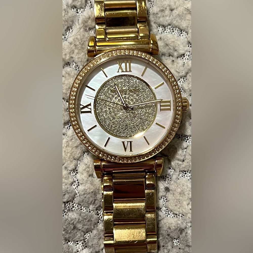 Women’s Michael Kors watch.